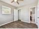 Bedroom with hardwood floors, a closet and an ensuite bathroom at 5601 16Th N St, St Petersburg, FL 33703