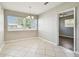 Bright dining room with a chandelier and natural light from a large window at 5601 16Th N St, St Petersburg, FL 33703