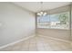 Bright dining area featuring tile floors and a large window offering natural light at 5601 16Th N St, St Petersburg, FL 33703