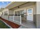 View of front entrance with porch and decorative rock landscaping at 5601 16Th N St, St Petersburg, FL 33703
