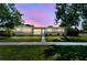 Charming single-story home featuring a well-maintained lawn and inviting walkway at 5601 16Th N St, St Petersburg, FL 33703