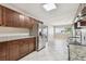 Spacious kitchen featuring granite countertops, stainless steel appliances, and tile flooring at 5601 16Th N St, St Petersburg, FL 33703