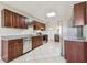 Updated kitchen with granite countertops, stainless steel appliances and tile flooring at 5601 16Th N St, St Petersburg, FL 33703