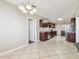 Spacious kitchen with stainless steel appliances, granite counters, and tile flooring at 5601 16Th N St, St Petersburg, FL 33703