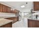 Bright kitchen with granite countertops, stainless steel appliances, and ample cabinet space at 5601 16Th N St, St Petersburg, FL 33703