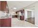 Open-concept kitchen with granite countertops, stainless steel appliances, and tile floors at 5601 16Th N St, St Petersburg, FL 33703