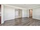 Open-concept living room featuring newly installed floors, modern paint, and easy access to other rooms at 5601 16Th N St, St Petersburg, FL 33703