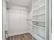 Walk-in closet featuring organized shelving and vinyl floors at 5601 16Th N St, St Petersburg, FL 33703