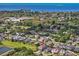 This aerial shot highlights the home's location in a vibrant neighborhood with water views at 879 De Soto Blvd, Tarpon Springs, FL 34689