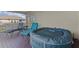 View of hot tub and outdoor seating on balcony at 879 De Soto Blvd, Tarpon Springs, FL 34689