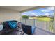 Balcony features hot tub, outdoor seating and view of pond at 879 De Soto Blvd, Tarpon Springs, FL 34689