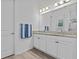 Modern bathroom with double vanity, granite countertops, and stylish fixtures at 879 De Soto Blvd, Tarpon Springs, FL 34689