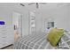 Charming bedroom with ensuite bathroom and closet at 879 De Soto Blvd, Tarpon Springs, FL 34689
