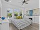 Serene bedroom featuring lots of windows and a decorative fireplace at 879 De Soto Blvd, Tarpon Springs, FL 34689
