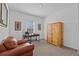 Cozy bedroom with an arm chair, desk and wooden wardrobe against white walls at 879 De Soto Blvd, Tarpon Springs, FL 34689