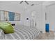 Well-lit bedroom featuring wood-look floors and an ensuite bathroom at 879 De Soto Blvd, Tarpon Springs, FL 34689