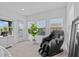 Inviting bedroom featuring a massage chair, bright natural light, and relaxing ambiance at 879 De Soto Blvd, Tarpon Springs, FL 34689