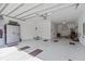 Spacious and clean garage with epoxy flooring, storage cabinets, and ample space at 879 De Soto Blvd, Tarpon Springs, FL 34689