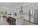 Beautiful kitchen with stainless steel appliances, tile backsplash and a large center island with seating at 879 De Soto Blvd, Tarpon Springs, FL 34689