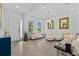 Bright and spacious living room featuring stylish tile floors, recessed lighting, and modern decor at 879 De Soto Blvd, Tarpon Springs, FL 34689