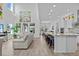 Spacious living room and kitchen with an island that has countertop seating at 879 De Soto Blvd, Tarpon Springs, FL 34689