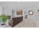 Comfortable loft featuring stylish artwork and a cozy sofa for relaxing at 879 De Soto Blvd, Tarpon Springs, FL 34689