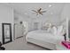 Spacious main bedroom with neutral tones, and ensuite bathroom at 879 De Soto Blvd, Tarpon Springs, FL 34689