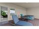 Comfortable patio with a lounge chair, a table with 2 chairs, and a jacuzzi at 879 De Soto Blvd, Tarpon Springs, FL 34689