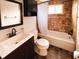 Well-lit bathroom with tiled shower and tub, updated vanity, mirror, and fixtures at 9201 86Th Ave, Seminole, FL 33777