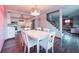Bright dining room with white furniture that connects to kitchen, living room, and staircase at 9201 86Th Ave, Seminole, FL 33777