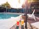 Relax by the pool, complete with chaise lounges, a tiki bar, lush landscaping, and sun-kissed beverages at 9201 86Th Ave, Seminole, FL 33777