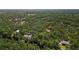 A home is nestled in the forest. Beautiful aerial view of home surrounded by nature at 9298 Carr Rd, Riverview, FL 33569