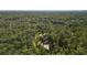 Areal view of a residence nestled in a lush, green landscape, offering a peaceful retreat away from the city at 9298 Carr Rd, Riverview, FL 33569