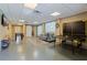 Finished basement rec room with painted concrete floors, ample lighting, and fun games for entertaining at 9298 Carr Rd, Riverview, FL 33569