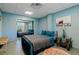 Finished basement bedroom with comfortable bedding, storage, and mirrored closet at 9298 Carr Rd, Riverview, FL 33569