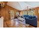 Inviting living room with wood floors, paneling, and access to the porch; an open, relaxing space at 9298 Carr Rd, Riverview, FL 33569