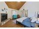 Large bedroom with fireplace and wooden floors at 9298 Carr Rd, Riverview, FL 33569