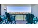 Balcony featuring outdoor seating overlooking a scenic view of the inter coastal waterway at 9495 Blind Pass Rd # 406, St Pete Beach, FL 33706