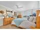 Bright bedroom featuring tile floor, neutral walls, and many decorations at 9495 Blind Pass Rd # 406, St Pete Beach, FL 33706