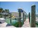 Dock and boat lift showing the ease of water access at 9495 Blind Pass Rd # 406, St Pete Beach, FL 33706