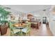 Charming dining room with a round table and vintage-style chairs adds character to the space at 9495 Blind Pass Rd # 406, St Pete Beach, FL 33706