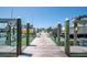 Close-up view of a wooden dock and a clear blue sky at 9495 Blind Pass Rd # 406, St Pete Beach, FL 33706