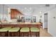 Well-lit kitchen with granite counters, stainless appliances, a breakfast bar, and ample cabinet space at 9495 Blind Pass Rd # 406, St Pete Beach, FL 33706