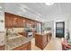 Beautiful kitchen featuring custom cabinetry, granite countertops, and stainless steel appliances at 9495 Blind Pass Rd # 406, St Pete Beach, FL 33706
