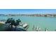 An aerial shot of the waterfront with boat docks and palm trees at 9495 Blind Pass Rd # 406, St Pete Beach, FL 33706