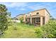 Spacious backyard featuring a covered patio and lush lawn at 11818 Valhalla Woods Dr, Riverview, FL 33579