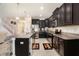 Spacious kitchen with stainless steel appliances and dark wood cabinets at 11818 Valhalla Woods Dr, Riverview, FL 33579