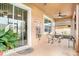Screened-in lanai with outdoor furniture and plants; sliding door access to the house at 11818 Valhalla Woods Dr, Riverview, FL 33579