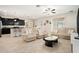 Spacious living room featuring an open floor plan, tile flooring, and comfortable seating arrangements perfect for relaxation at 11818 Valhalla Woods Dr, Riverview, FL 33579