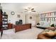Home office with large desk, comfortable seating, and medal display wall at 11818 Valhalla Woods Dr, Riverview, FL 33579